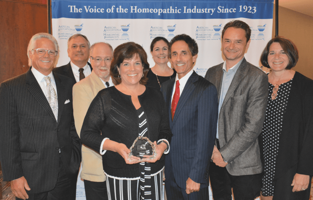 Karen Shadders, Wegmans Food Markets Vice President of Health, Wellness, Home & Entertaining accepts the Integrative Medicine Award from the board members of American Association of Homeopathic Pharmacists at the group’s Summit, June 27 in Baltimore.